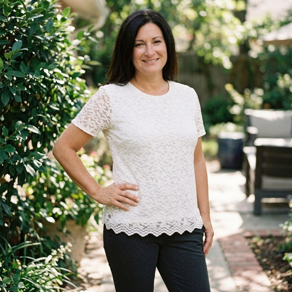 Woman wearing Teddi Rose white lace top with short sleeves, size Large