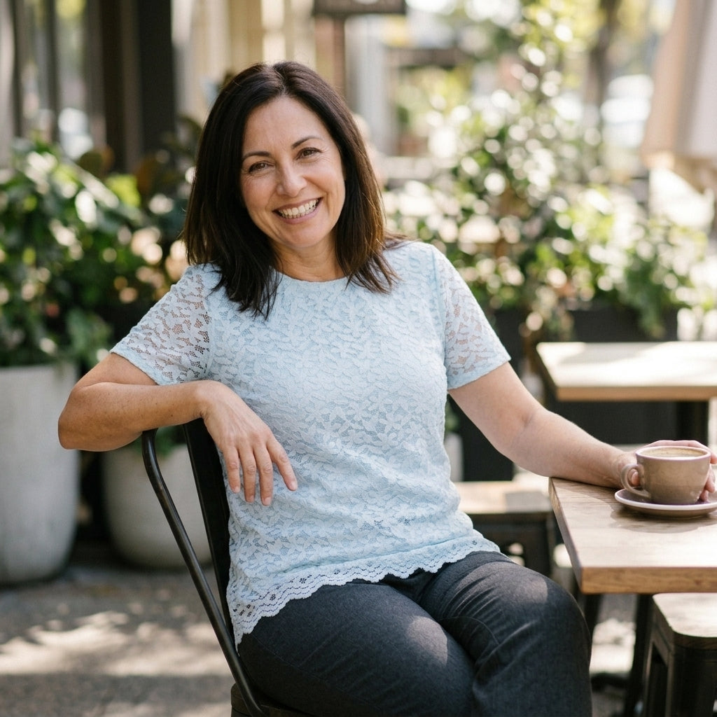 Woman wearing Teddi Rose light blue lace top with short sleeves